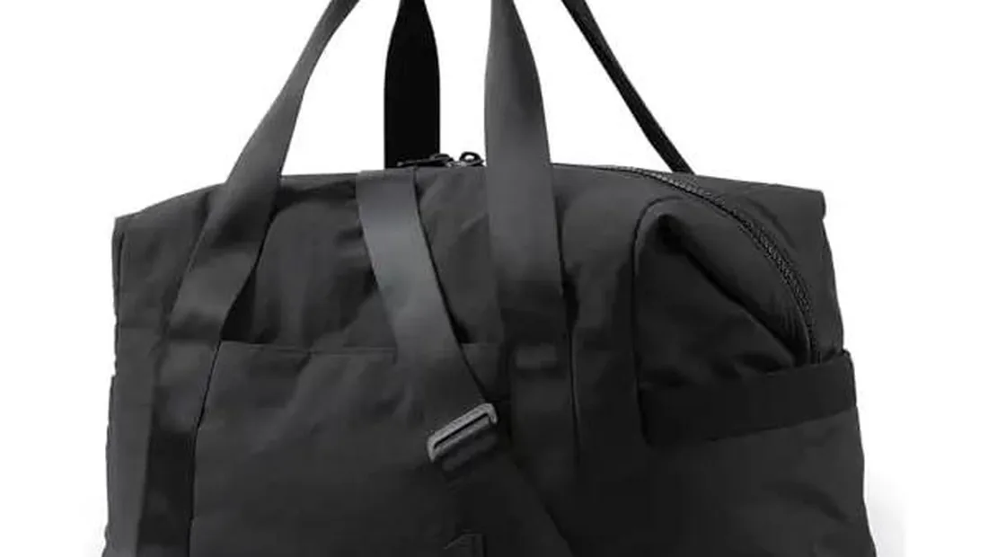 Packing cubes for duffel bags arranged inside an open duffel